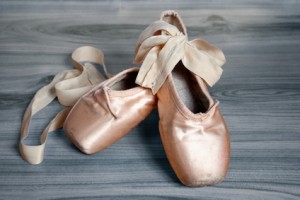 ballet slippers on a wood floor Bascjground
